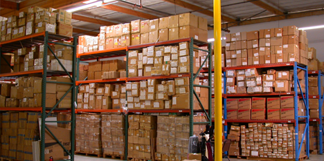 A warehouse full of boxesDescription automatically generated with low confidence